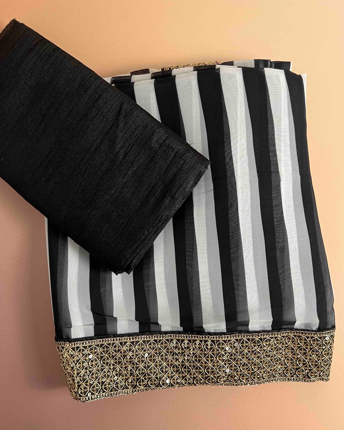 Riya Black & White Georgette Saree with Embellished Gold Border